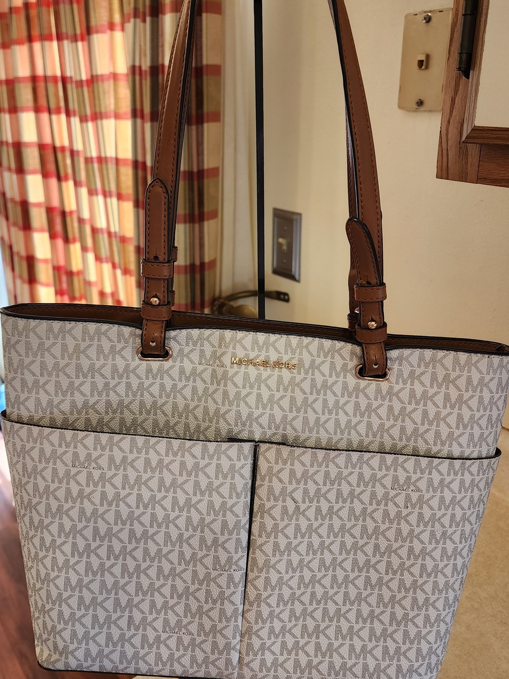 Michael Kors Bedford Medium Logo Tote in a white and brown vanilla colorway.